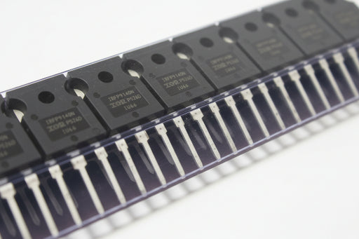 Close-up of electronic components with 'IRFP9140NPBF' branding on a metallic surface.