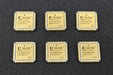 Five Xilinx chips on a dark surface